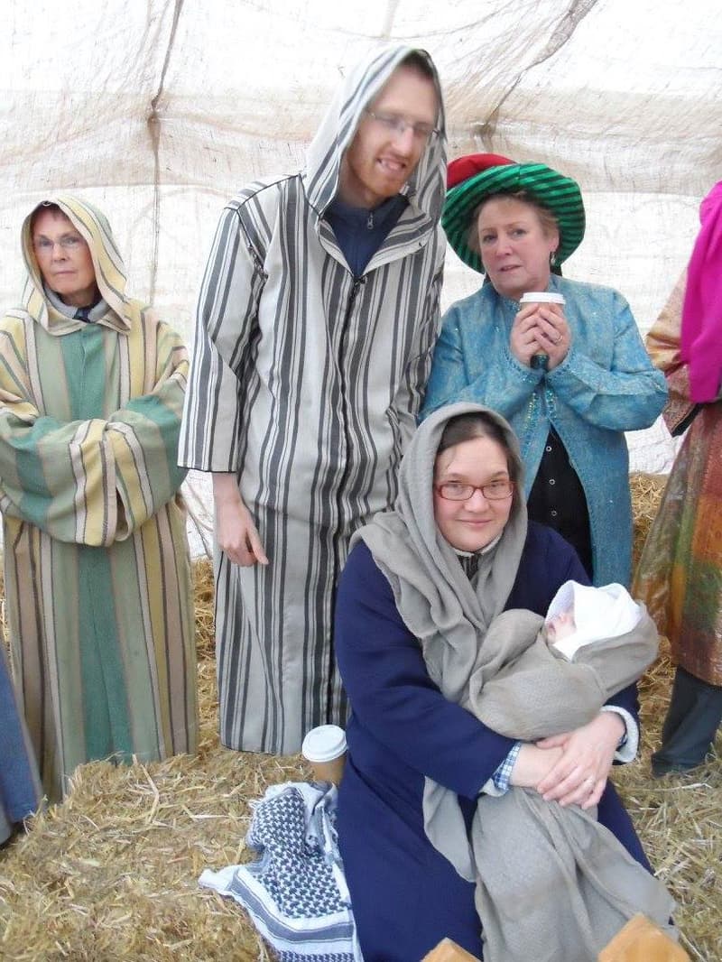 Family in nativity scene